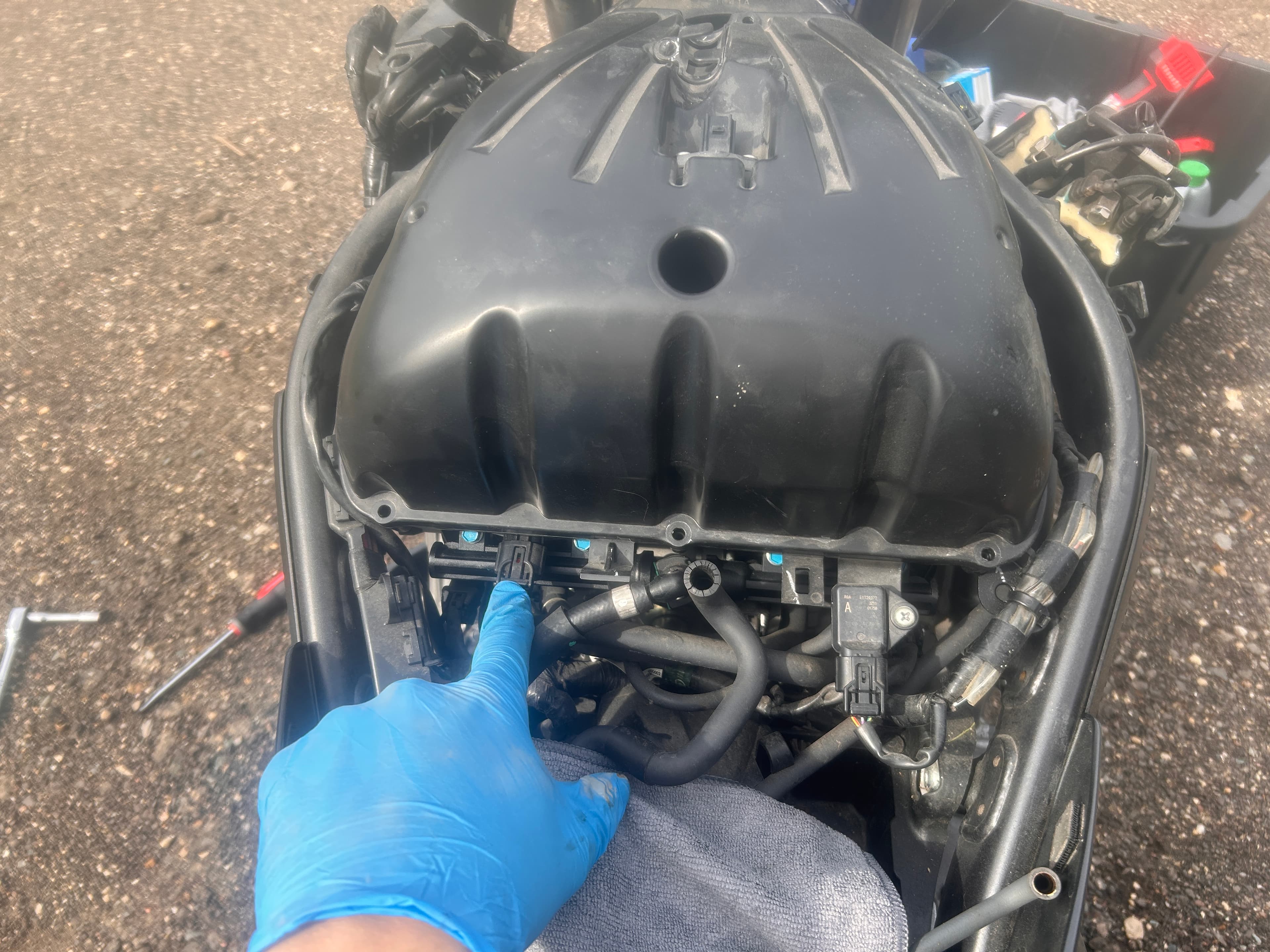 Motorcycle undergoing head gasket service